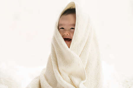 baby with towelの写真素材