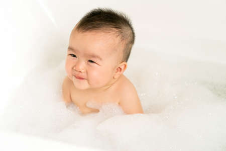 baby taking bathの写真素材