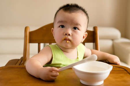 baby having mealの写真素材