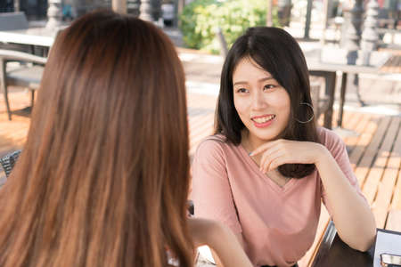 two girls are chattingの写真素材