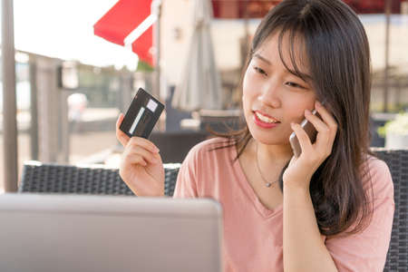 girl calling watching laptopの写真素材