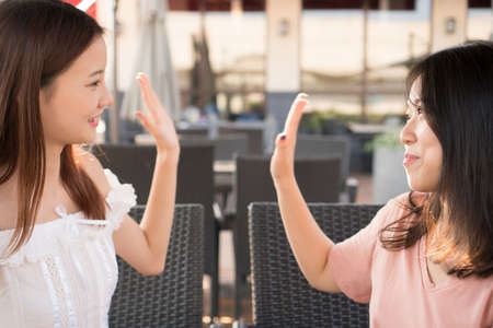 tow girls  high fiveの写真素材