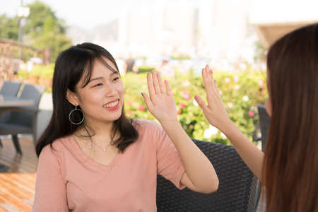two girls  high fiveの写真素材