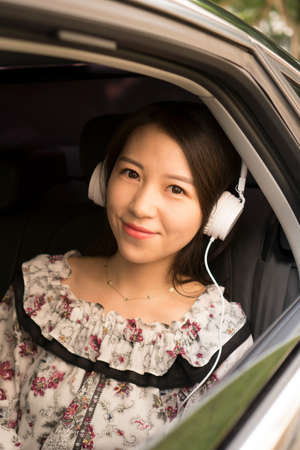 asian girl in carの写真素材