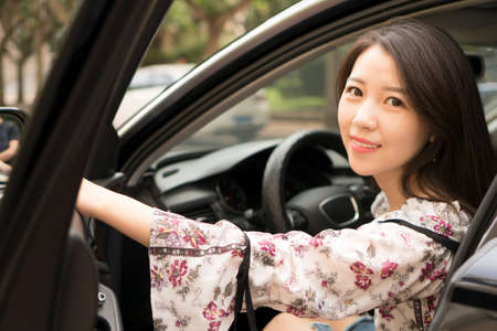 asian girl in carの写真素材