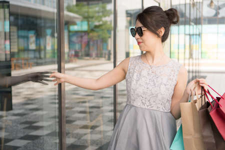 asian girl with shopping bagsの写真素材