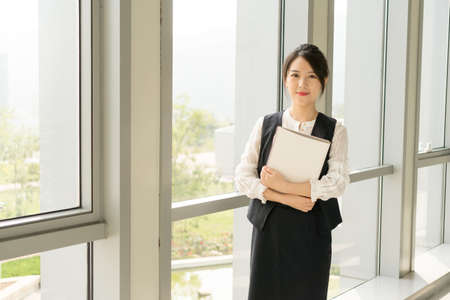office lady holding a documentの写真素材