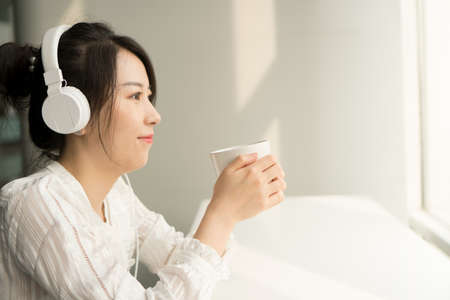 office lady in headphoneの写真素材