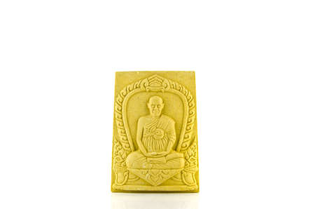 Thai brown buddha image (amulet) isolate on whiteの写真素材