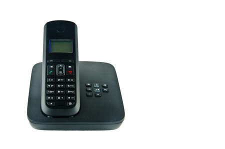 Wireless black telephone with cradle isolated on white backgroundの写真素材