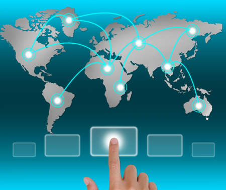 Hand pushing a button touch screen interface in wide world.