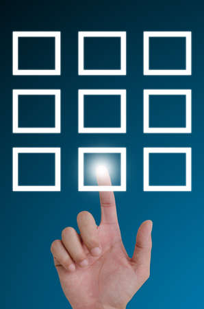 hand pushing a button on a touch screen interface.の写真素材