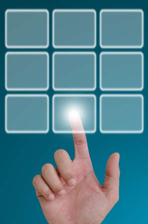 hand pushing a button on a touch screen interface.の写真素材