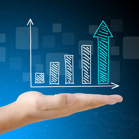Business graph on handの写真素材