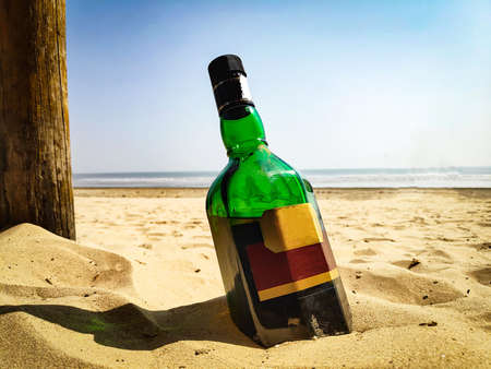 sea beach through a wine bottleの写真素材