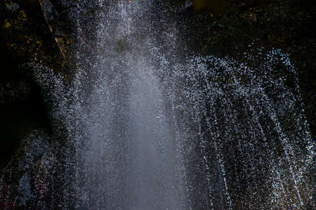 a water fountain in action in the evening