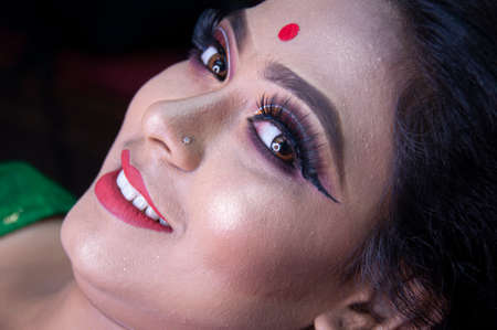 an indian woman with bridal makeup