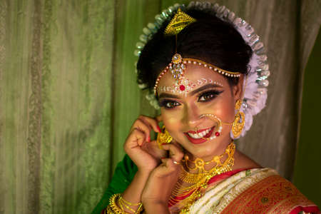 a girl in her marriage day adjusting her jewelry