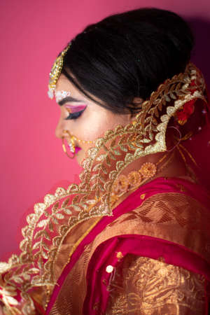 portrait of beautiful woman with bright bridal makeup and jewellery