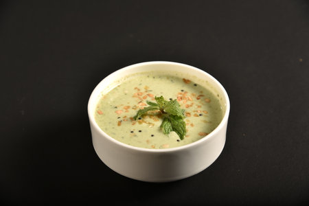 Raita is an Indian dish made with yogurt, spice powders, herbs & veggies like onions, cucumbers & carrotsの写真素材