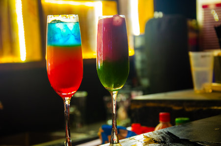 Colorful cocktails on the bar counter in the night club. Alcoholic drinksの写真素材