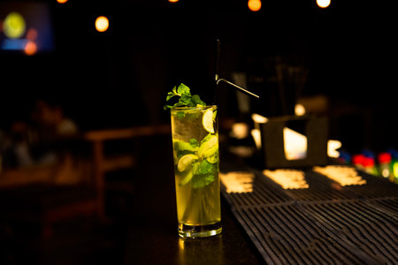 Mojito cocktail on bar counter in night club. Selective focusの写真素材