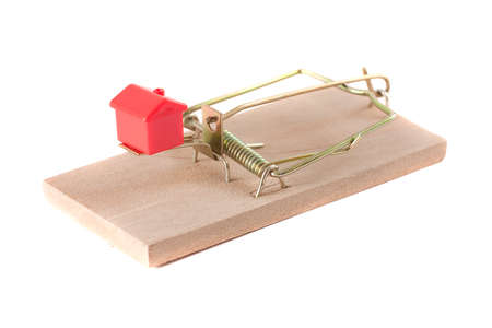 A monopoly house in a mouse trap. Symbolizing a bad motrgage contract.の写真素材