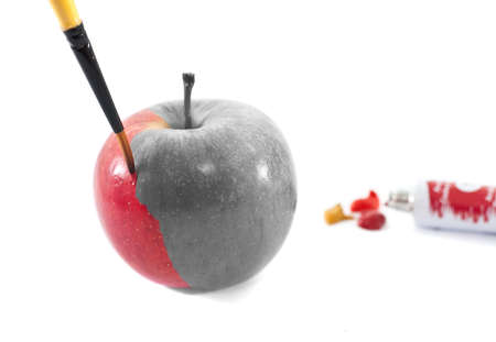 A black and white apple being coloredの写真素材