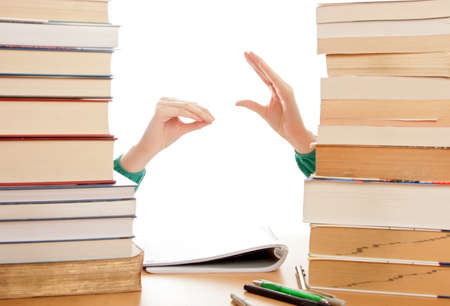 Girl got bored of studying, plays with her hands.の写真素材