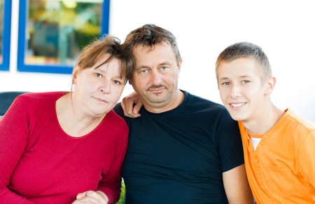 Portrait of a beautiful family -father, mother and son.の写真素材