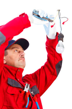 Handyman using cutter to fix the lights.の写真素材