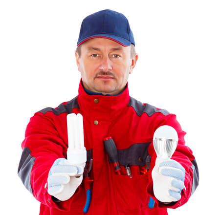 Handyman showing energy saver bulb and led bulb.の写真素材