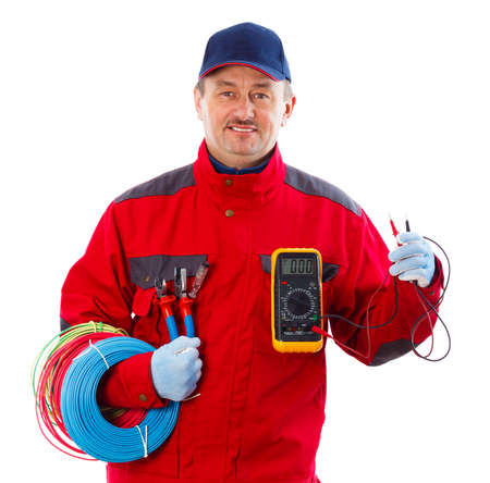 Handsome confident electrician with electrical equipment.の写真素材