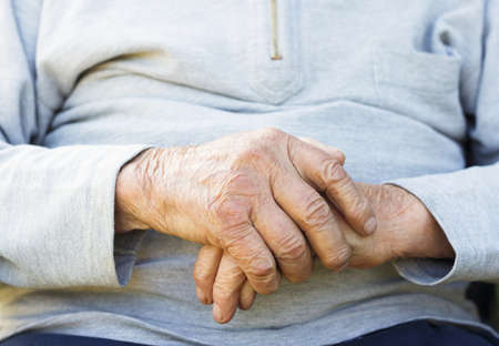 Lonely senior man praying for better life.の写真素材