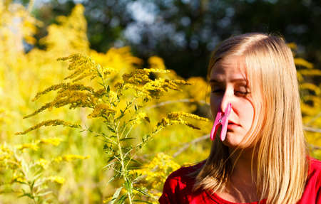 Preventing inspiration of ragweed pollen because of allergy.の写真素材