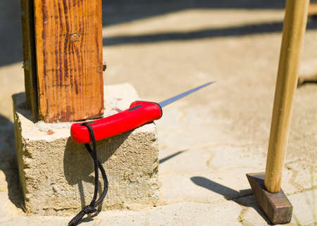 Prepared handyman tools such as hammer on the sidewalk to plaster yard place.