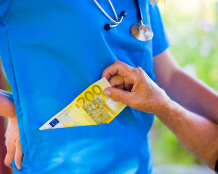 Closeup of corruption in health care industry by bribery.の写真素材