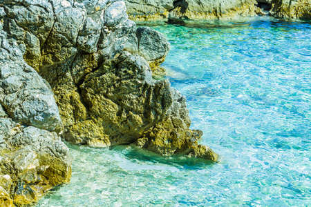 Crystal clear sea water at summer travel destination croatian mediterranean beach.の写真素材