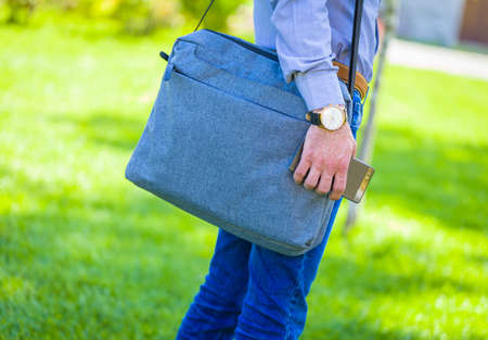 Closeup of businessman bodypart walking to presentation meeting.の写真素材