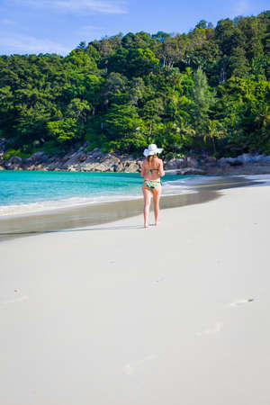 Woman walking on freedom beach in thailand.の写真素材