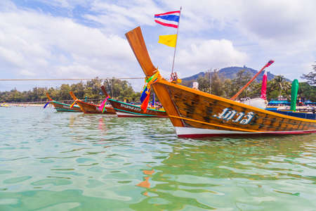 Close up of taxi boats on kata beach, thailand.のeditorial素材