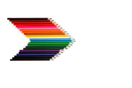 set of colored pencils arranged in the shape of an arrow with the right pencil on a white...