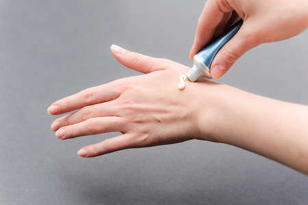 Skin care for female hands. Apply cream on your left hand.の写真素材