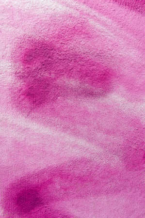 pink background: the white wall is unevenly painted with pink paint sprayed with an aerosol canの写真素材