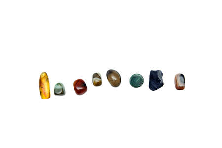 various semiprecious stones on a white background, from above, isolate