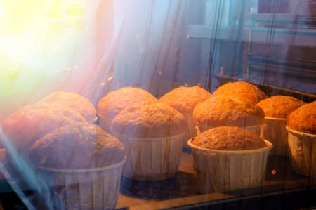 the process of baking cupcakes with an oven cabinet, low key.