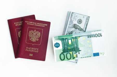 Two foreign passports of the Russian Federation, a pack of notes of 100 dollars and eurosの写真素材