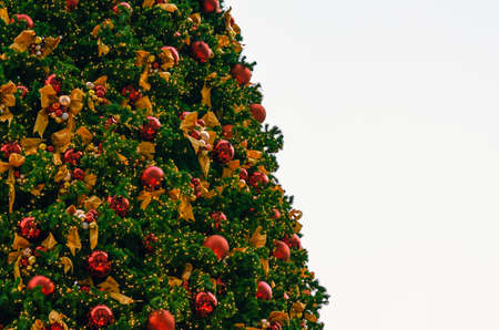 Christmas tree decorates with many ornaments for Christmas Holiday festival.