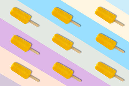 Yellow ice cream on colorful background for minimal and summer background concept.の写真素材