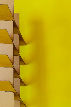 Paper box cutting and set as square shape on yellow background for background and textured concept.